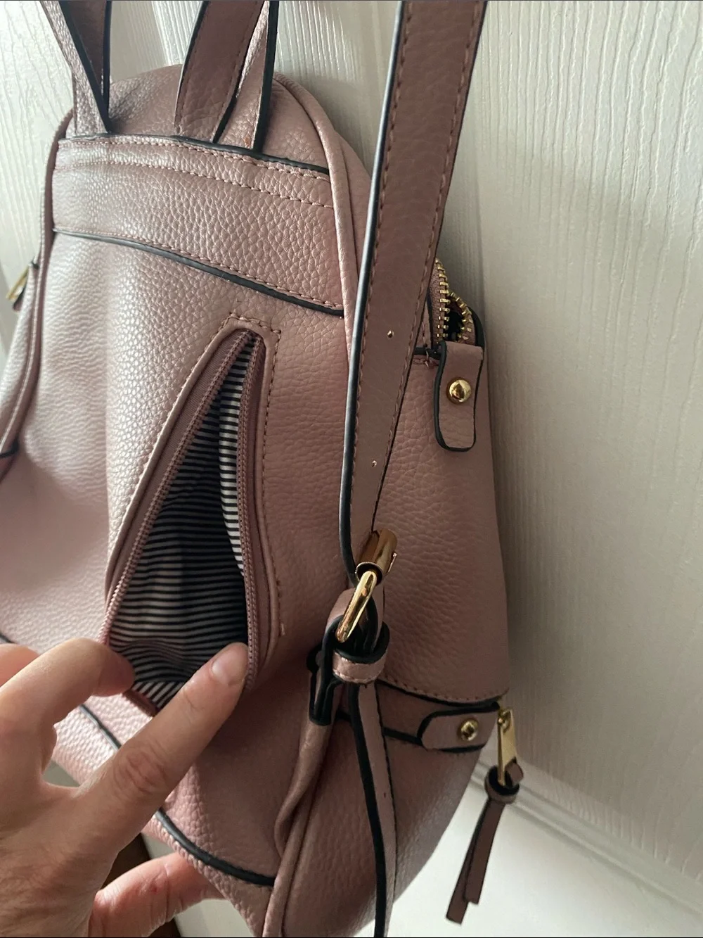 Blush Pink Mini Backpack with Gold Hardware and Striped Lining.